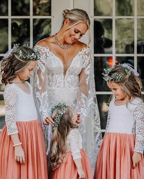 A bride with her flower girls at Rustic Ranch Farms